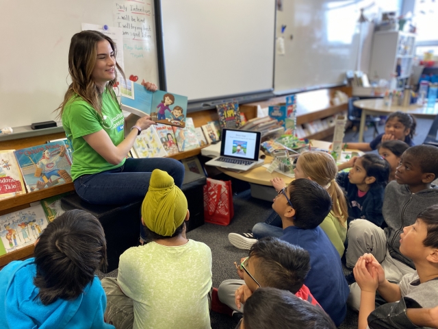U of M grad student Samantha Clemis teaches school children about agriculture