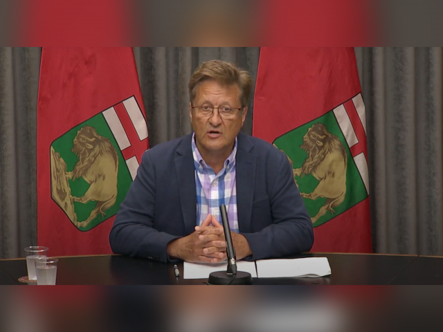 Infrastructure Minister Ron Schuler seen giving an update on flooding